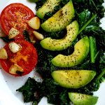 Seared kale and tomato with avocado olive oil and lemon