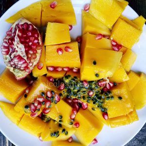 Fruit salad with mango, passion fruit, pomegranate