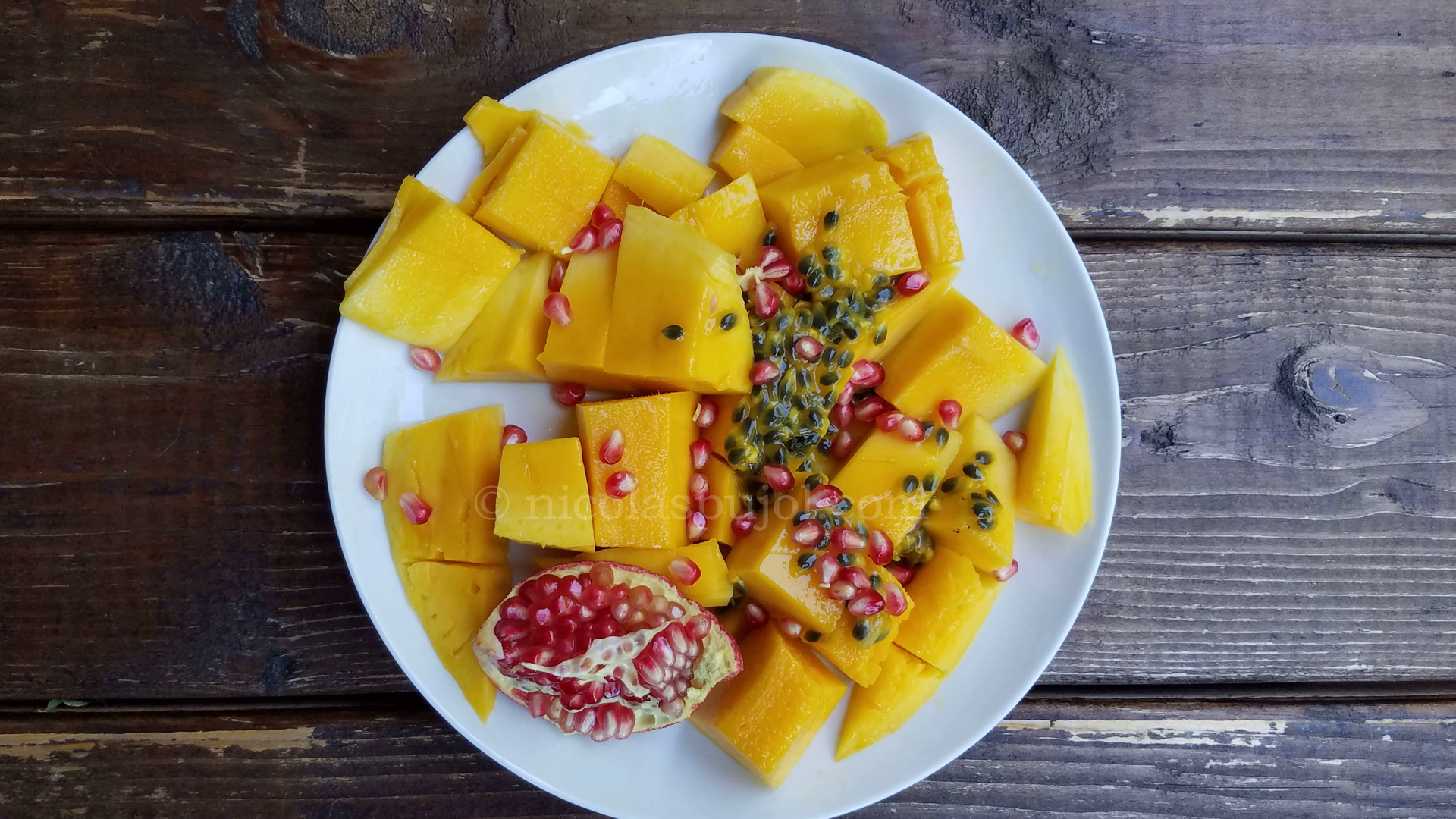 mango passion fruit and pomegranate breakfast