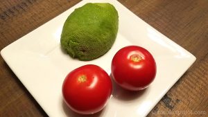 Avocado and tomatoes for vegan oatmeal