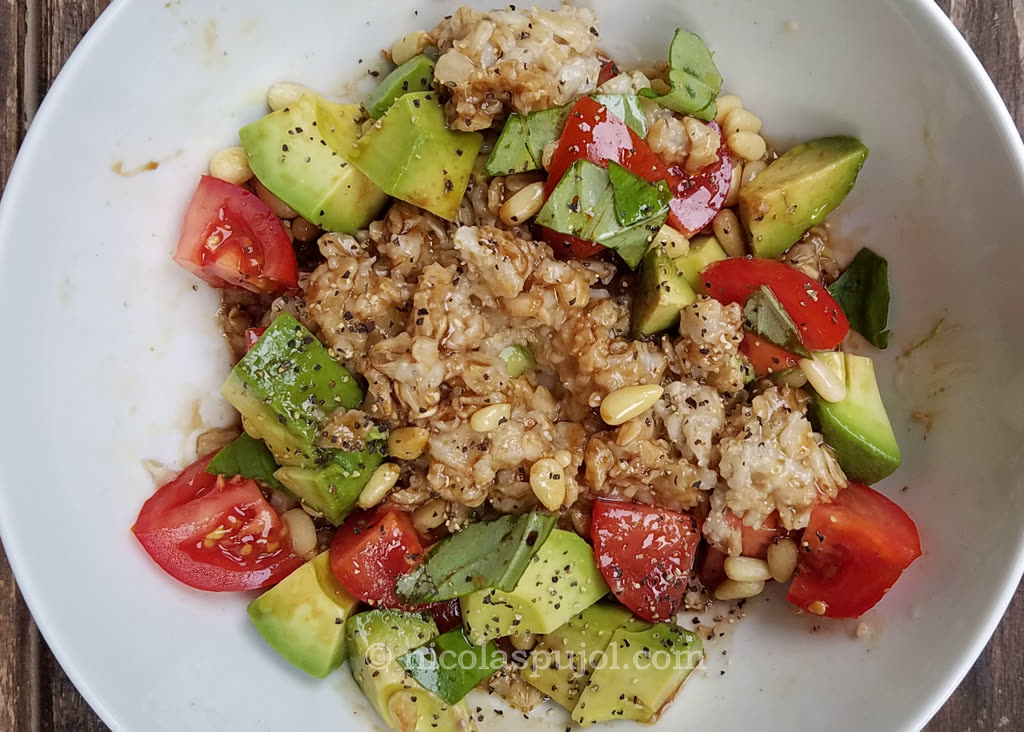 Vegan oatmeal with avocado and tomatoes