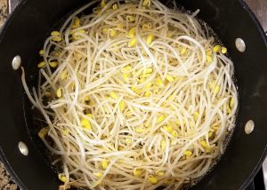 Soft boil the soybean sprouts