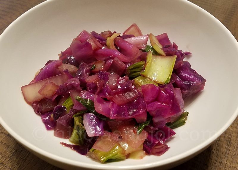Bowl of red cabbage baby bok choy stir fry
