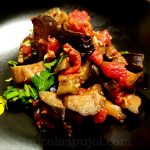 Vegan eggplant with diced tomatoes garlic parsley