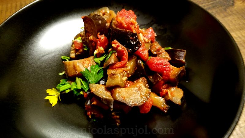 Vegan eggplant with diced tomatoes garlic parsley