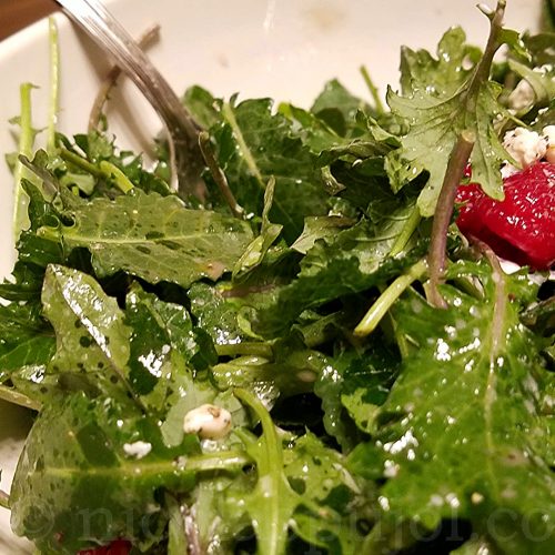 Baby kale salad with lemon and olive oil dressing