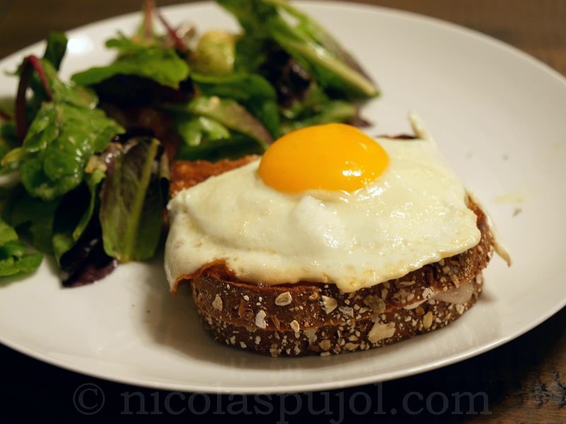 Croque madame with French lettuce salad