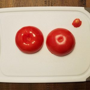 Cut the tomatoes in two and remove the stem scar