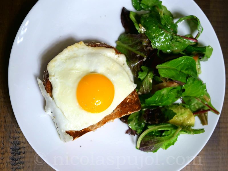 French croque-madame with lettuce salad