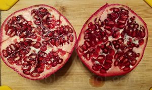 Slice pomegranate into halfs