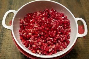 Strain the pomegranate seeds