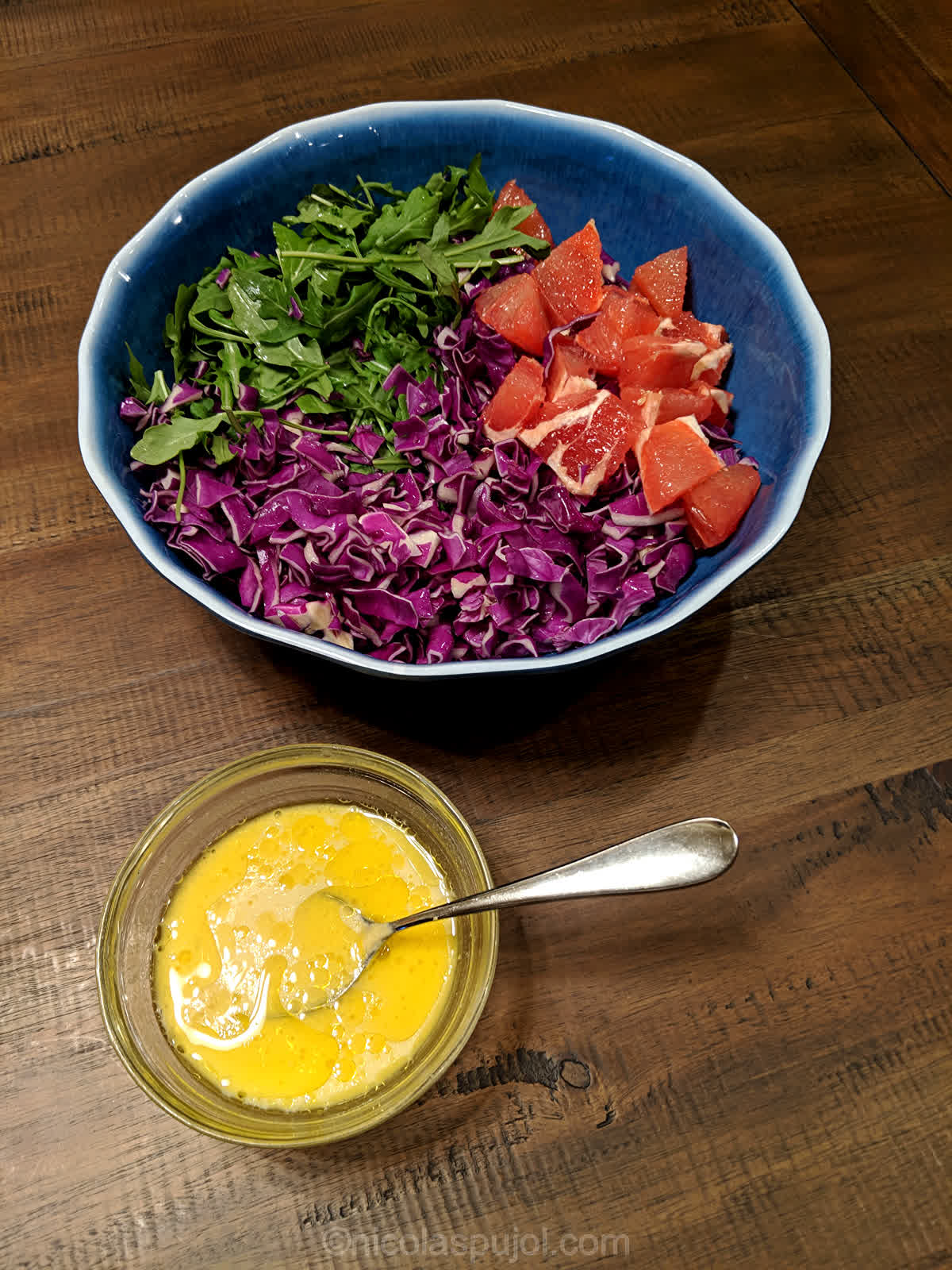 Arugula, red cabbage and grapefruit salad in French lemon dressing