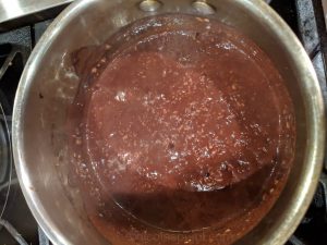 Keep stirring chocolate oatmeal with almond milk