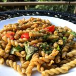 Oil-free pasta salad with arugula tomato and garbanzo beans