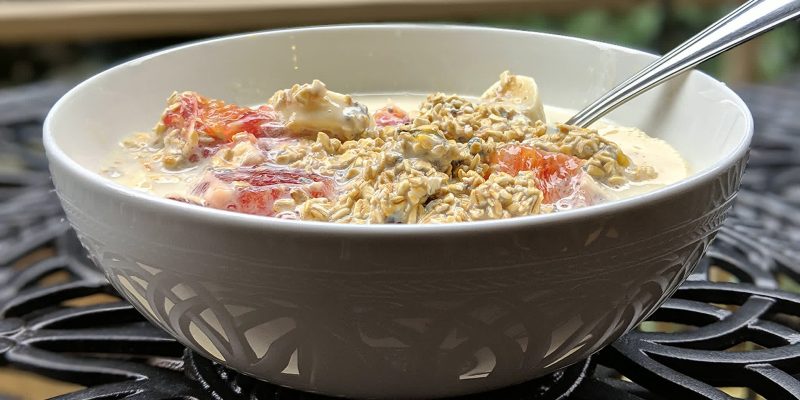 Orange banana oatmeal with soy milk and passion fruit