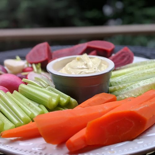 Vegan platter with carrots, cucumber, celery, radishes and beets