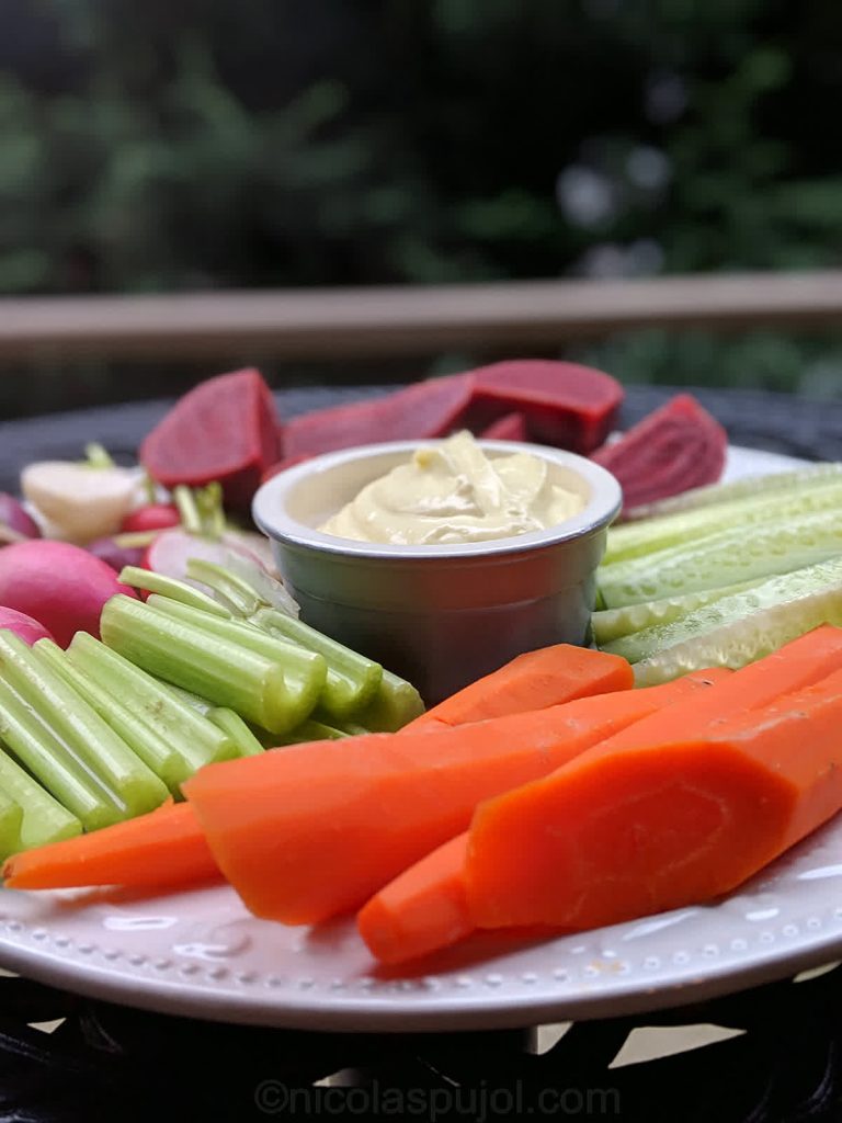 Vegan platter with carrots, cucumber, celery, radishes and beets