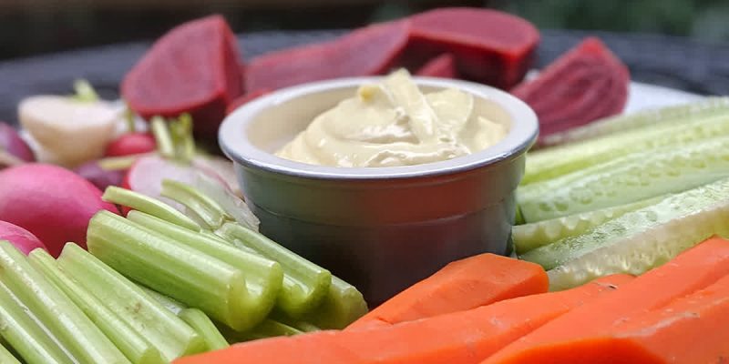 Vegan platter with carrots, cucumber, celery, radishes and beets