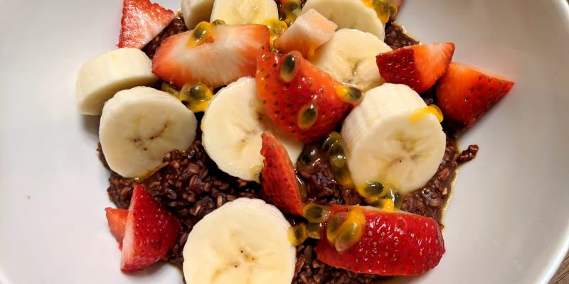 Vegan unsweetened chocolate oatmeal with fruits