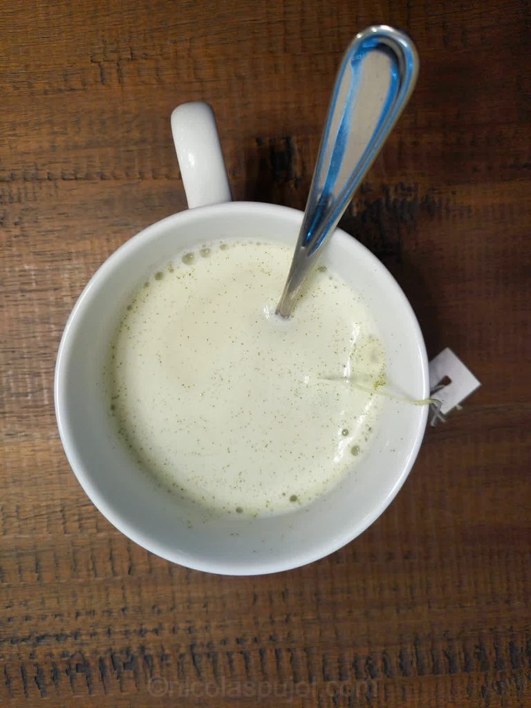 Almond milk green tea latte drink