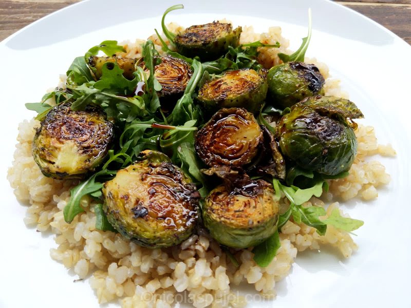 Baked Brussels sprouts on bed of arugula and brown rice