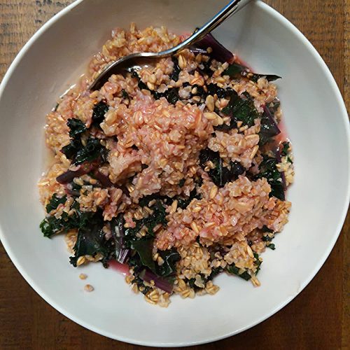 Kale cooked in oatmeal with lemon juice dressing