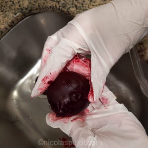 Peeling the beets once baked