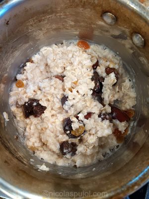 mix in dry fruits into cooking oatmeal