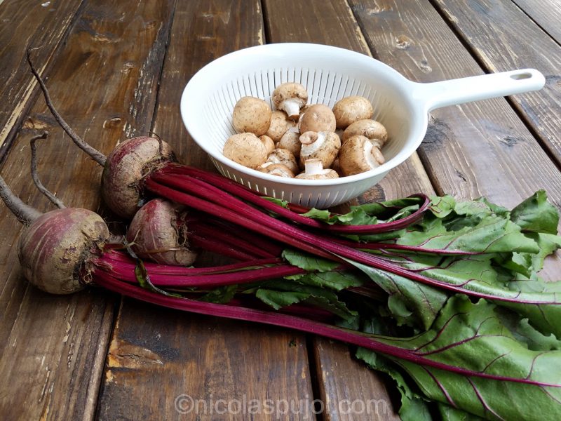 Fresh beet greens and brown crimini mushrooms