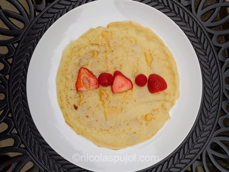 Plant-based soy milk crepe with berries and maple syrup