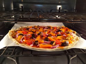 Vegan eggplant bell pepper BBQ pizza in the oven