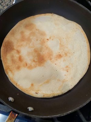 Vegan soy milk crepe on a non-stick pan