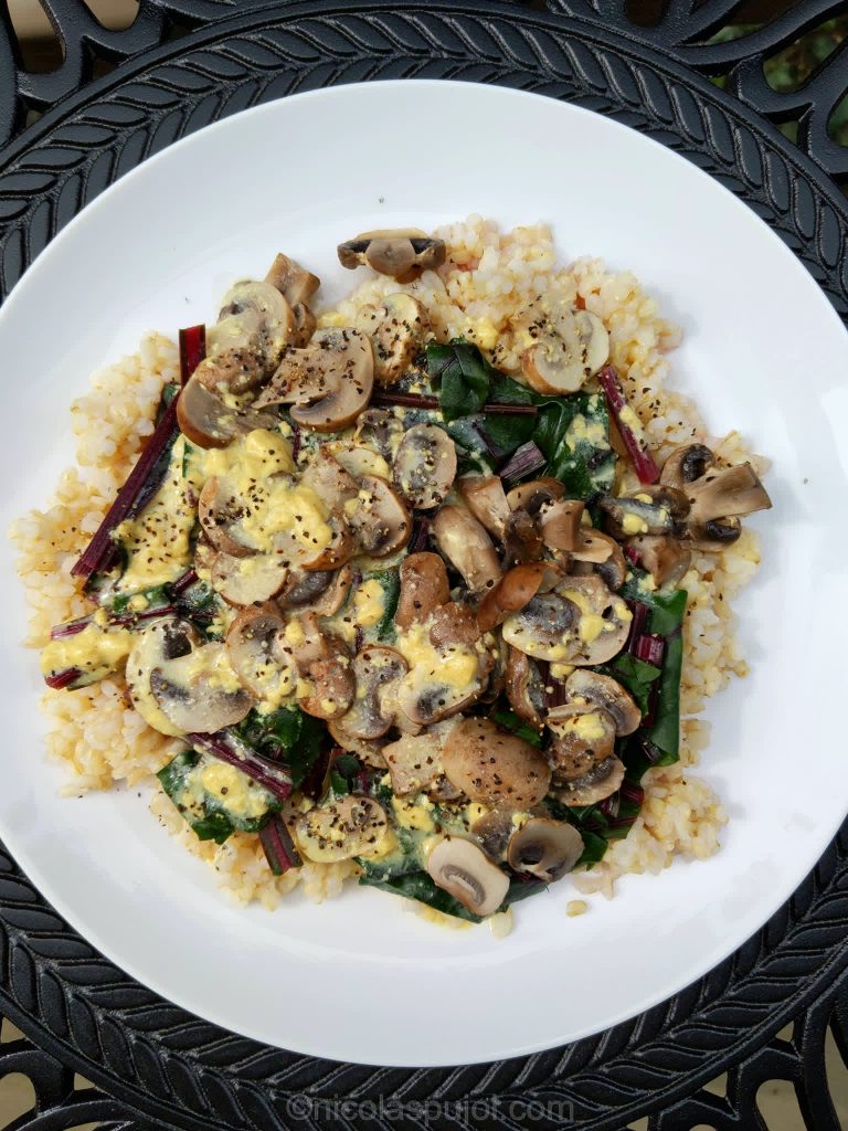 Mushrooms over beet greens and rice with French dressing