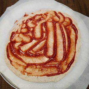 pizza dough with tomato paste
