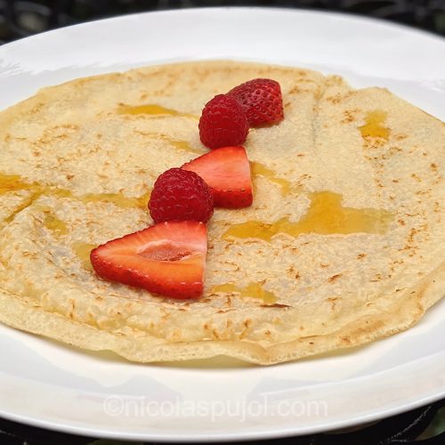 Soy milk vegan crepe with berries and maple syrup