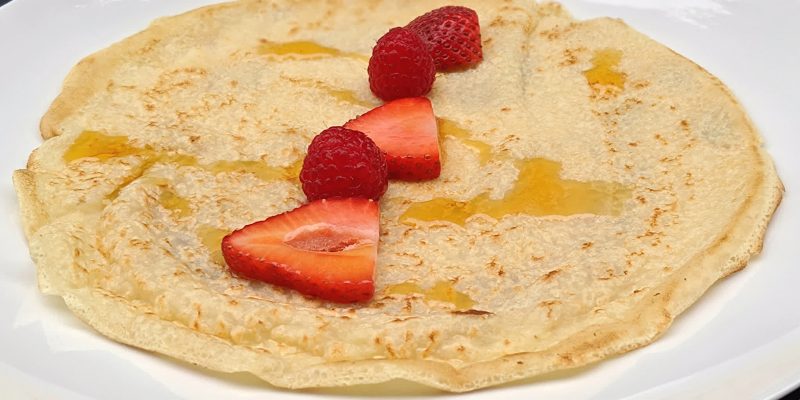 Soy milk vegan crepe with berries and maple syrup