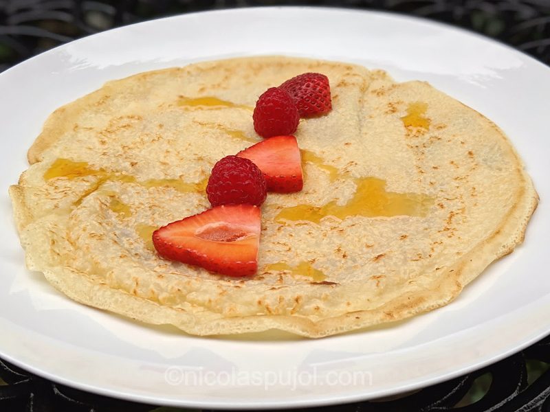 Soy milk vegan crepe with berries and maple syrup