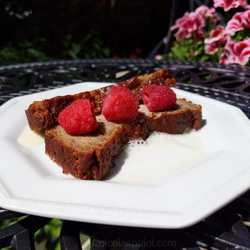 Vegan banana bread with berries and plant milk as decoration